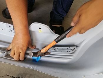 Midsection of man working in workshop