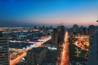 Illuminated cityscape at night