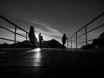 Silhouette of woman at sunset
