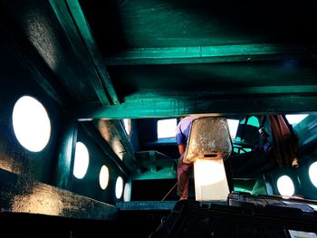 Low angle view of illuminated ceiling
