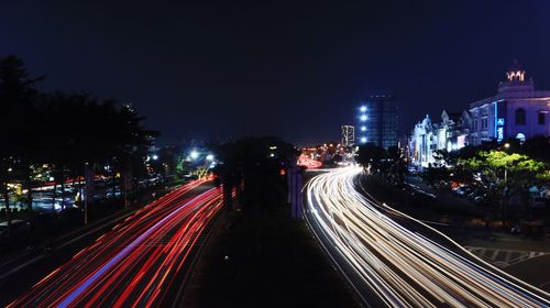 High angle view of light trails on road at night