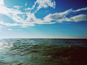 Scenic view of sea against blue sky