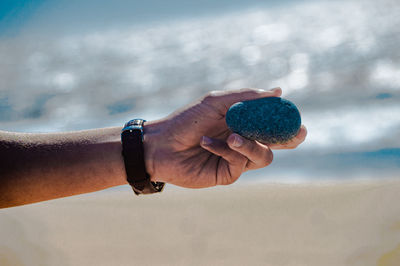 Close-up of hand holding crystal ball