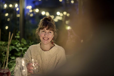 Smiling woman having meal