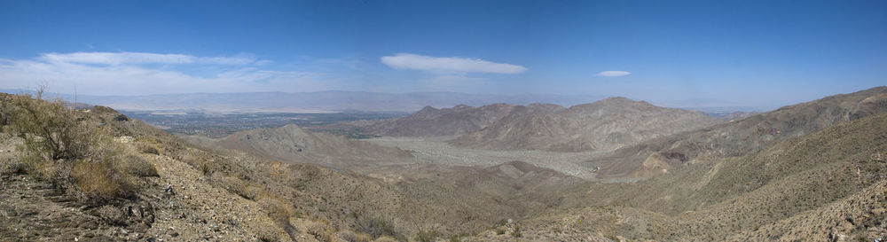 View of desert against cloudy sky