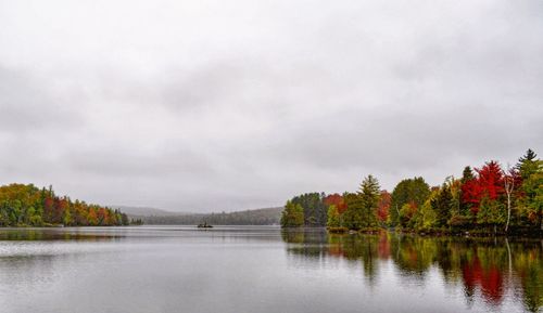 Scenic view of lake against sky during autumn