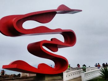 Low angle view of red wall