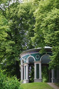 Low angle view of built structure against trees