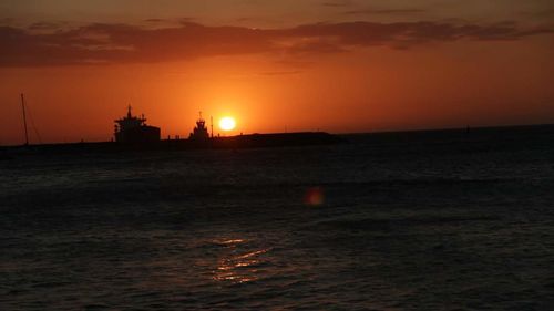 Scenic view of sea against sky during sunset