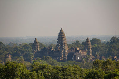 Panoramic view of trees and buildings against clear sky