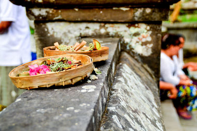 Close-up of container on retaining wall