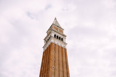 Low angle view of clock tower against sky