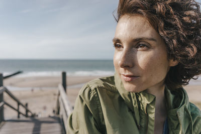 Portrait of woman on boardwalk at the beach