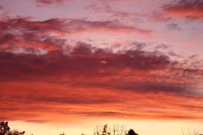 Low angle view of dramatic sky during sunset