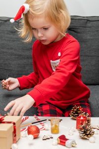 Boy playing with toy blocks at home