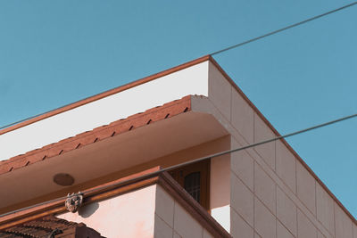 Low angle view of building against clear blue sky