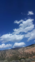 Scenic view of landscape against cloudy sky