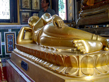 Buddha statue in temple outside building