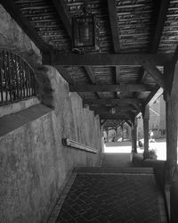 Empty road leading to building