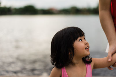 Portrait of woman standing in water
