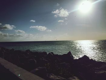 Scenic view of sea against sky at sunset