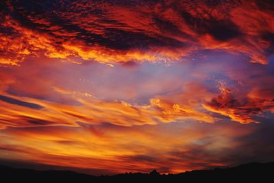 Scenic view of dramatic sky during sunset