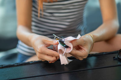 Midsection of woman working on table