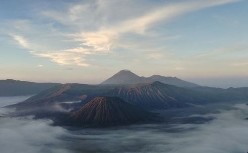 View of volcanic mountain against cloudy sky