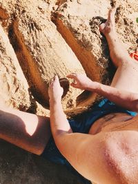 High angle view of people relaxing on beach