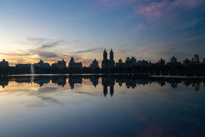 Scenic view of river against sky during sunset