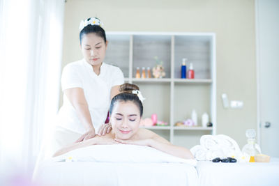 Young woman during spa. woman relaxing in bed spa.