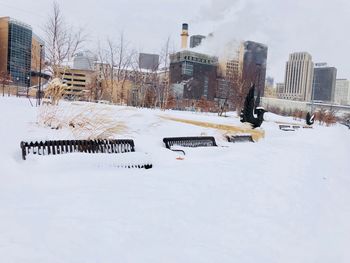 View of snow covered buildings in city