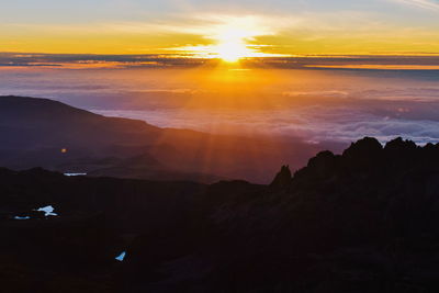 Sunrise above the clouds at at point lenana, mount kenya national park, kenya