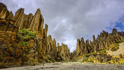 Panoramic view of trees and rocks against sky