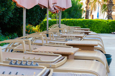 Empty chairs and tables at beach