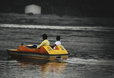 Men in boat on river