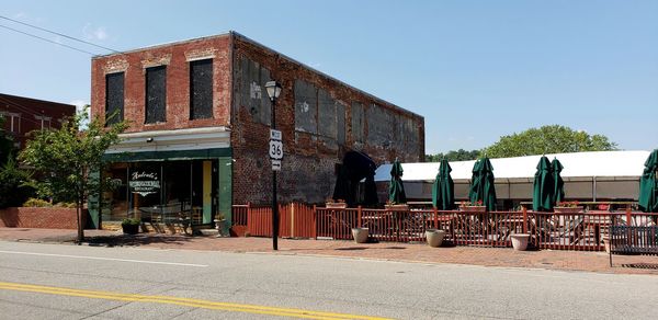 Abandoned building against clear sky