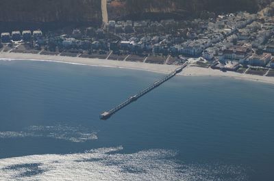 High angle view of city by sea