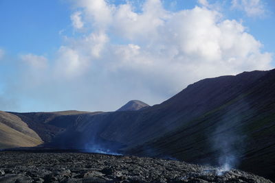 Scenic view of volcanic mountain against sky