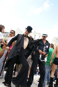 People on street against sky