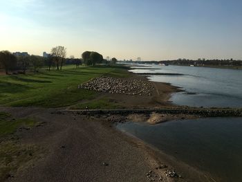 Scenic view of beach against clear sky