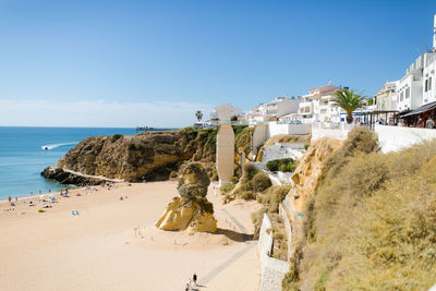 Panoramic view of beach and buildings against sky