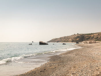 Scenic view of beach against clear sky