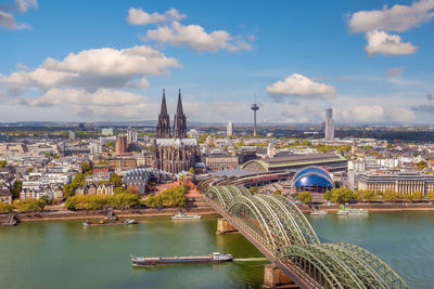 High angle view of buildings in city against sky