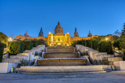 The national palace on montjuic mountain in barcelona illuminated at dawn