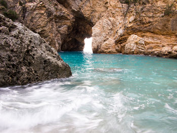 Scenic view of rock formation in sea