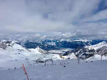 Aerial view of snowcapped mountain against sky