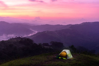 High angle view of tent on mountains against sky during sunset
