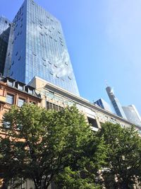 Low angle view of building against clear blue sky