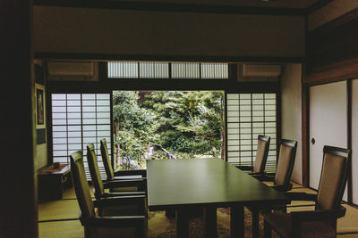 Empty chairs and tables in restaurant